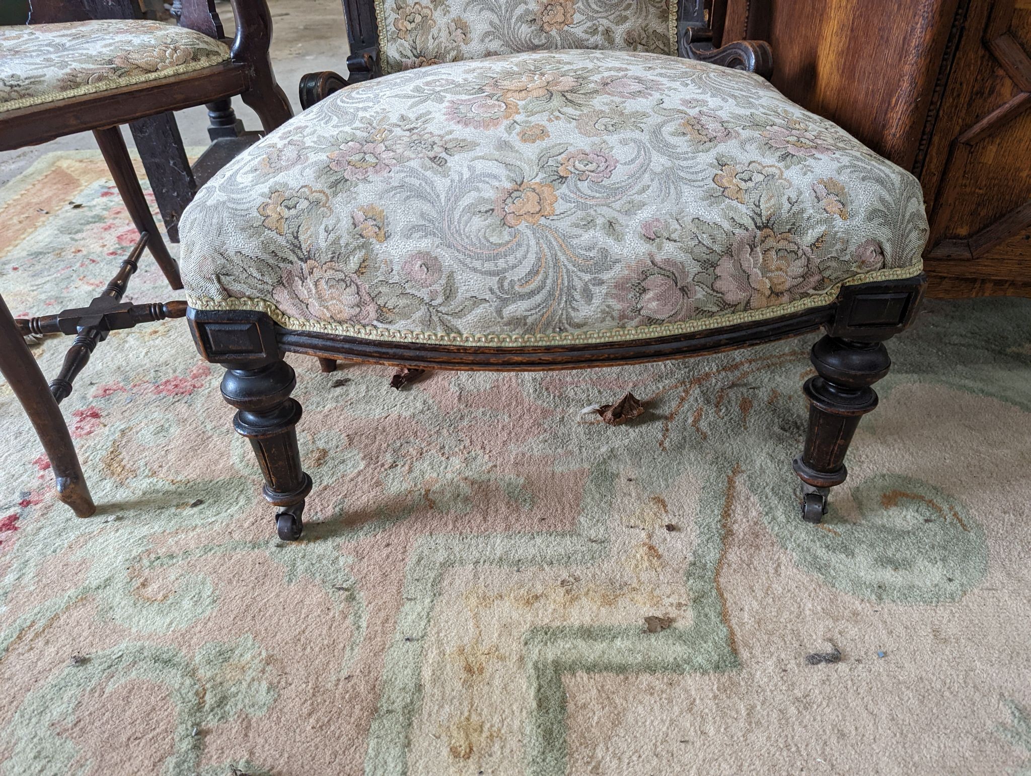 A late Victorian upholstered nursing chair and an Edwardian inlaid mahogany corner elbow chair